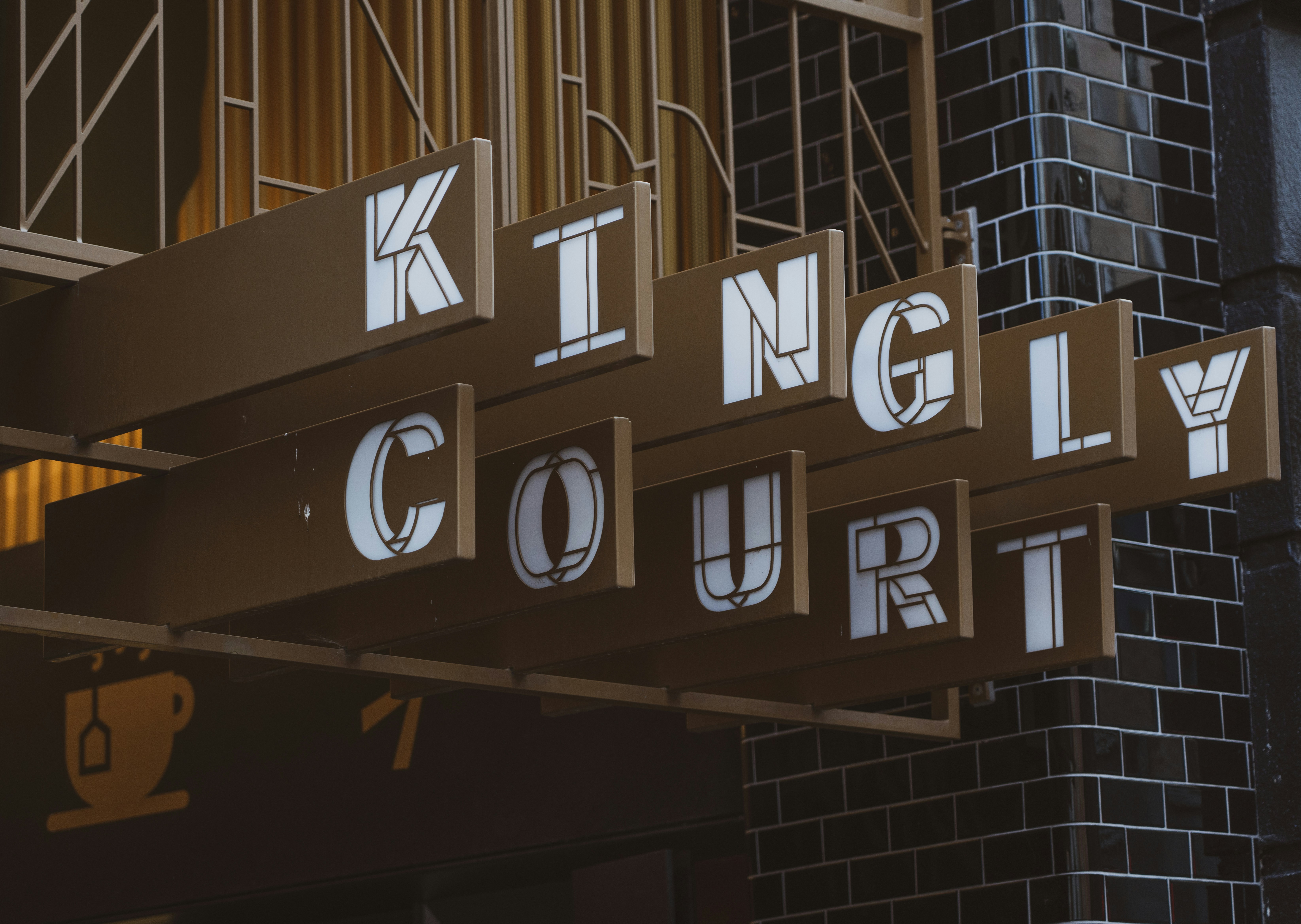 a close up of a street sign with a building in the background